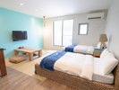 和洋室はクイーンベッドが2台設置されても広々とした空間です。