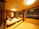 夜景側◆モダンな琉球畳の上にベッドを配した和洋室。畳のお部屋は足を伸ばして寛げる。