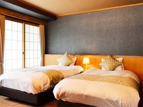 ヒノキ展望風呂付客室。赤坂・迎賓館でも使用されているNIHON　BEDでゆっくりとおやすみください。