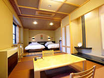 *新客室の和洋室です。ベッドはシモンズ社製で、贅沢な造りとなっております。