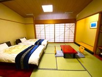 【有隣館/ツインルーム】ベッド2台を設置した12畳の和室。