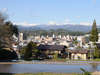 田んぼと街と北アルプスと桜ゲストハウス。A rice field, a town, north-Alps and Sakura-guest-house.